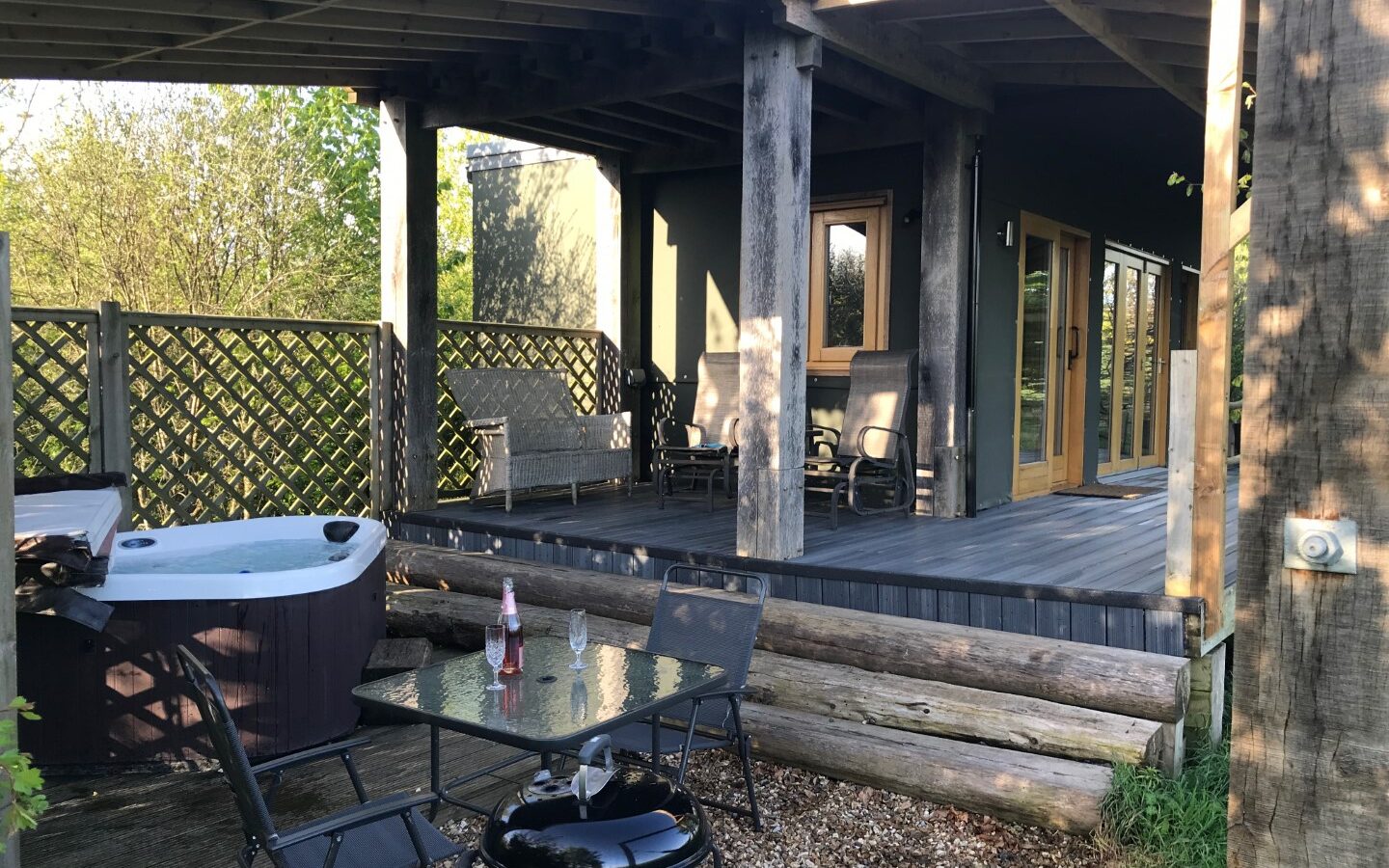 Experience relaxation at its finest on a patio complete with a luxurious hot tub. Nestled in the serene surroundings of Chilterns View Lodges, this oasis offers the perfect escape from everyday life.