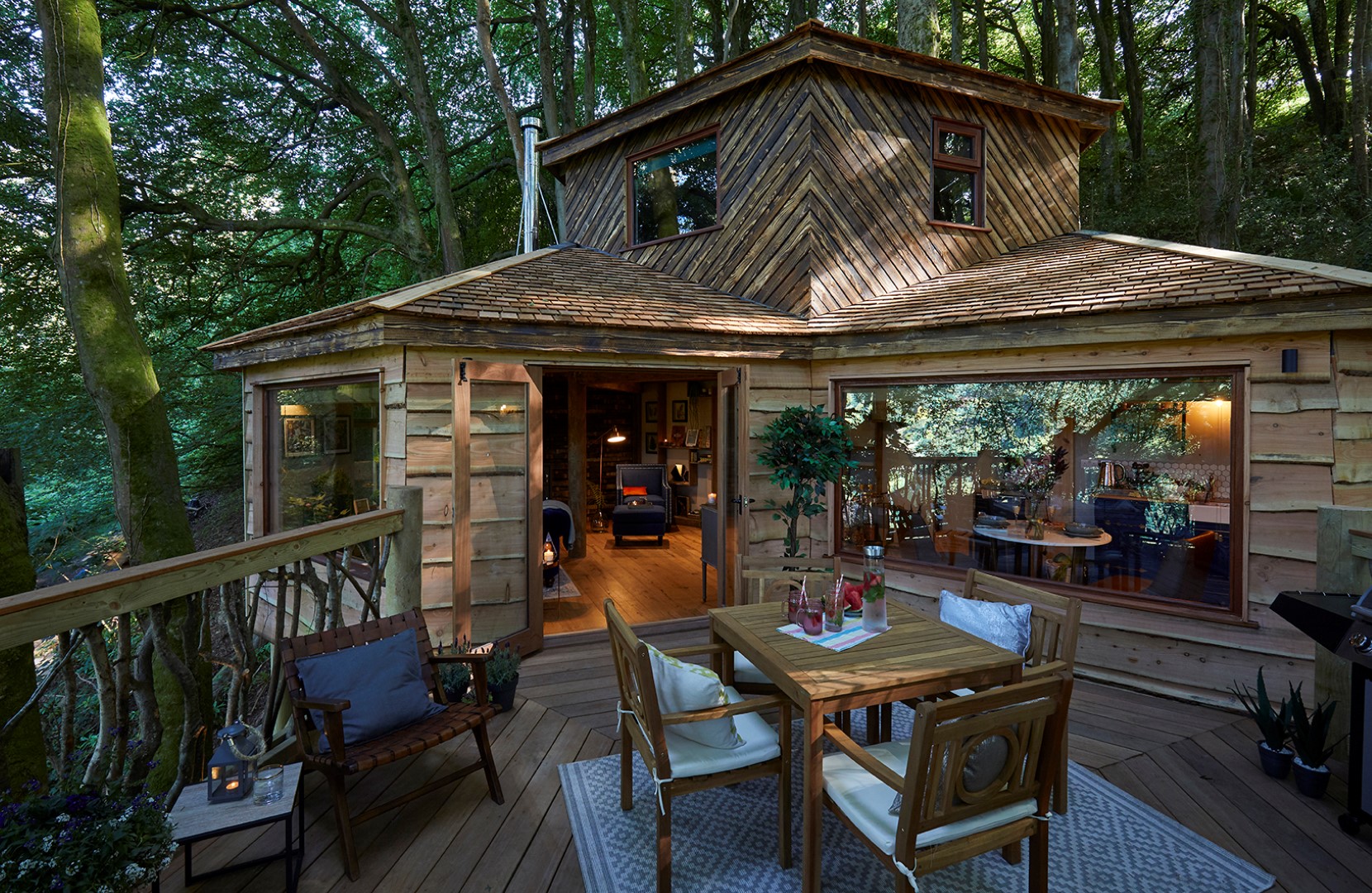 Ravendere Treehouse with it's own barrel sauna, hot tub and cold water bucket shower on a private deck, perfect for luxury wellness retreats uk 