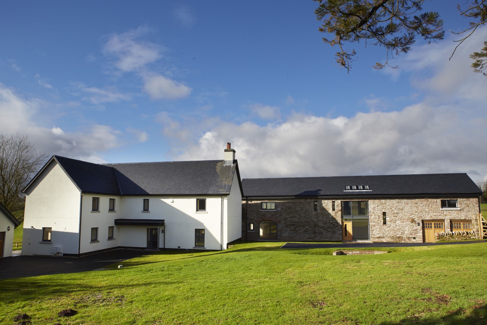 The modern kitchen of Celtic Manor Barn located at Celtic Manor Golf. Group accommodation sleeping 8 ideal for families looking for accommodation this Christmas. Large group holiday homes UK