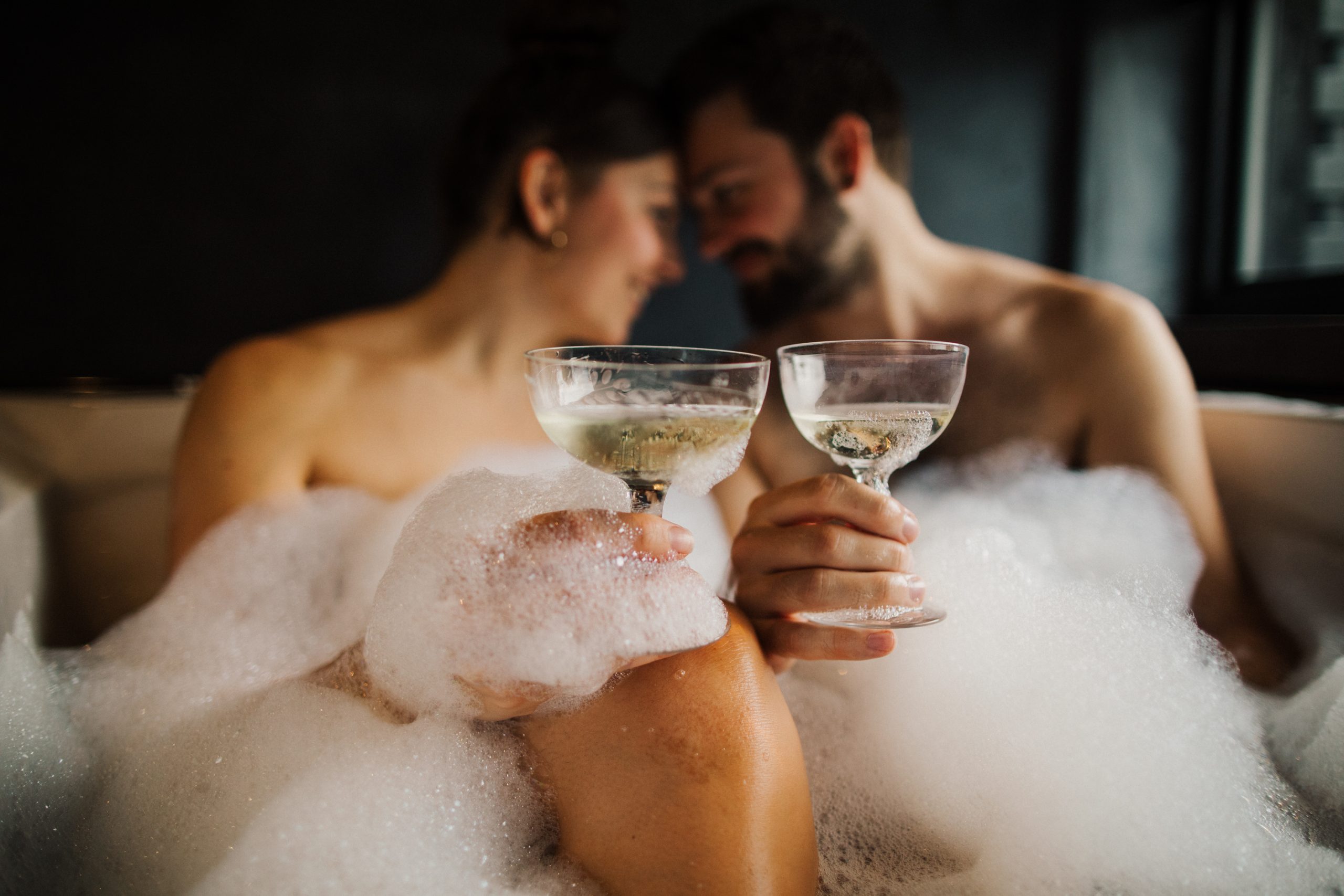 couple cheers champagne glasses